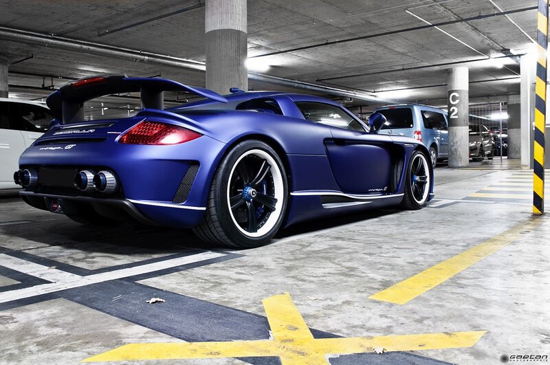 Blue sports car in parking garage