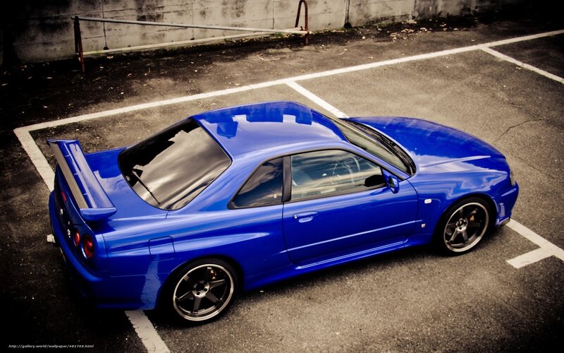 blue sports car in parking lot
