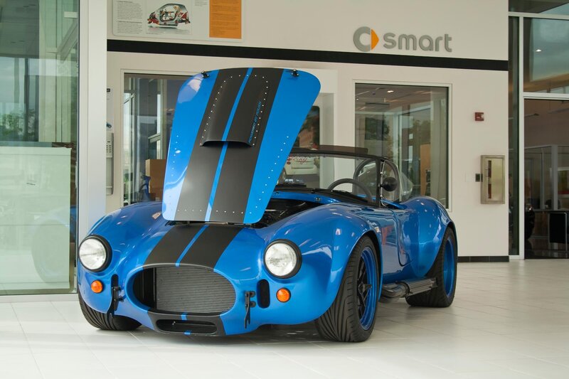 Blue sports car in showroom