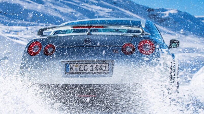 Blue Sports Car in Snow