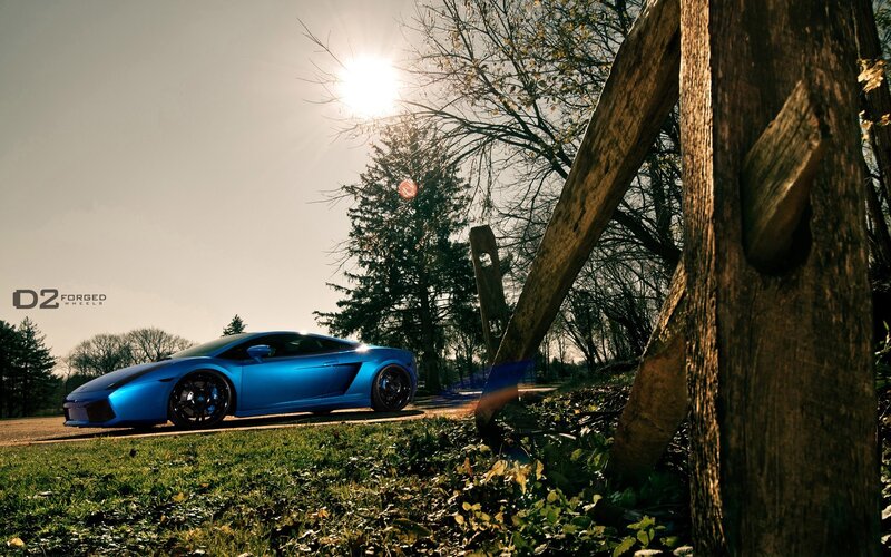 Blue sports car in sunlight