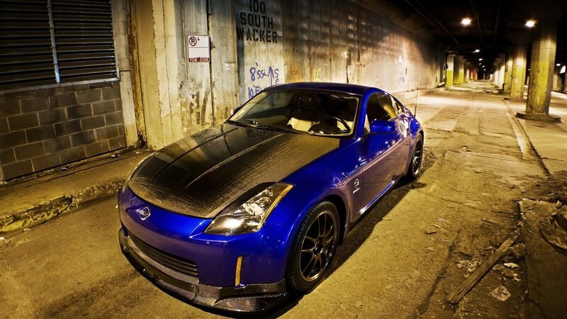 blue sports car in tunnel
