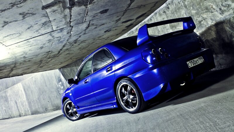 blue sports car in tunnel