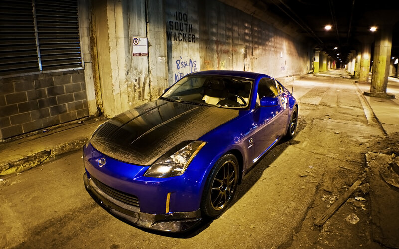 blue sports car in tunnel