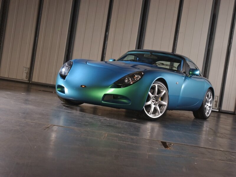 blue sports car in warehouse