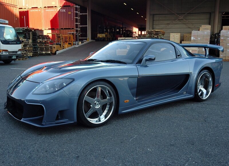 Blue sports car in warehouse