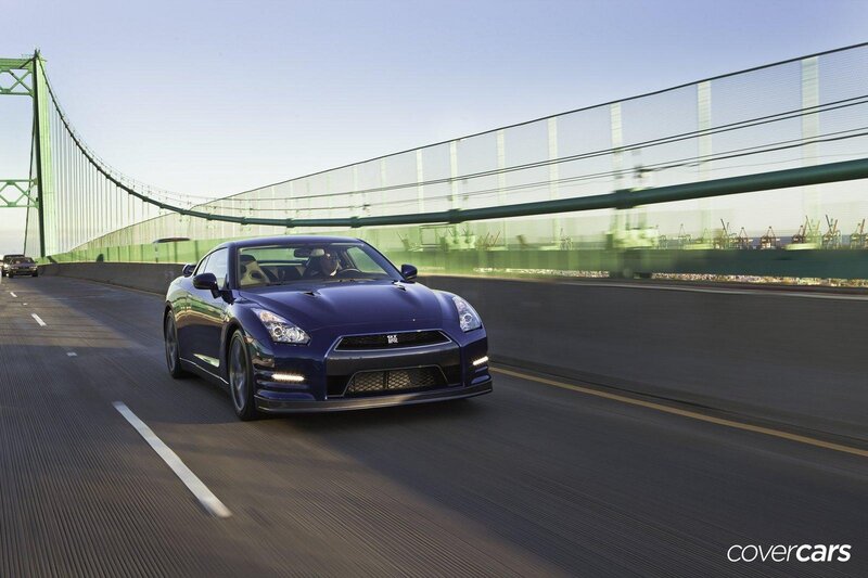 Blue sports car on a bridge