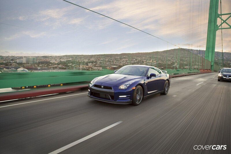 Blue sports car on a bridge