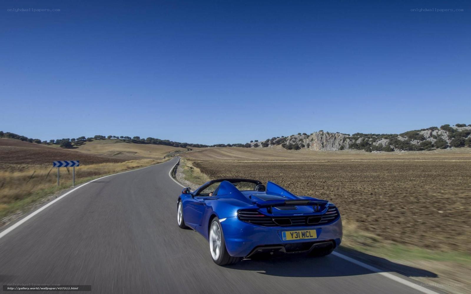 Blue sports car on a country road