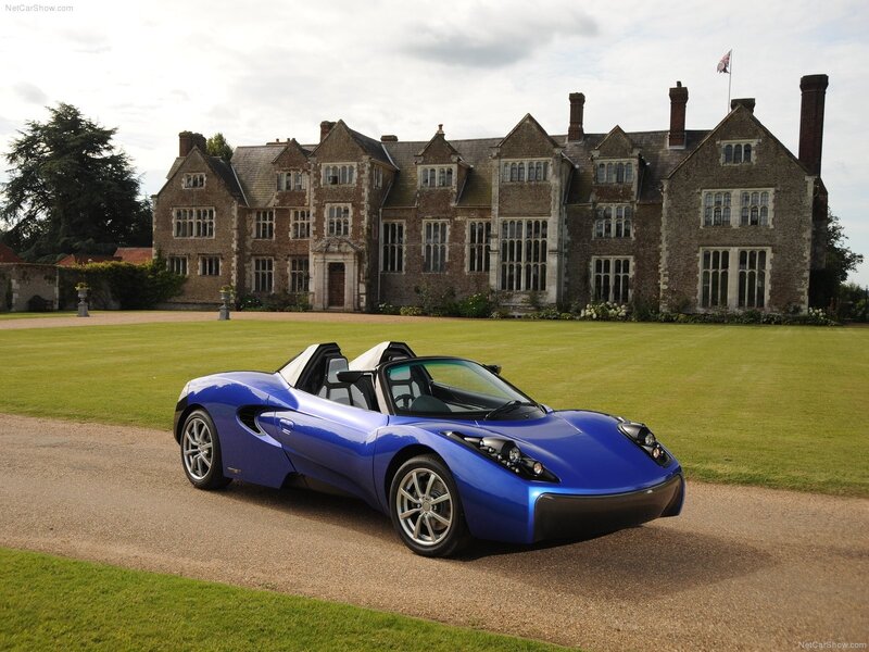 Blue sports car on a driveway