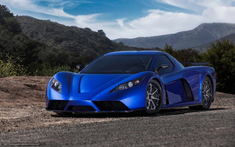Blue sports car on a mountain road