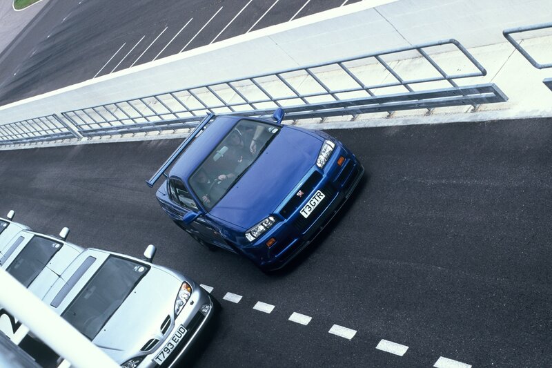 Blue sports car on a racetrack
