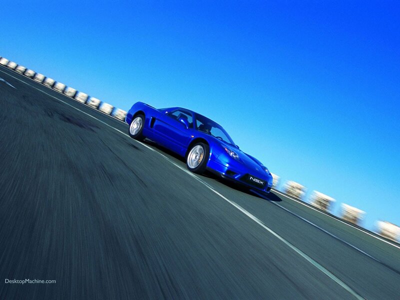 Blue sports car on a racetrack