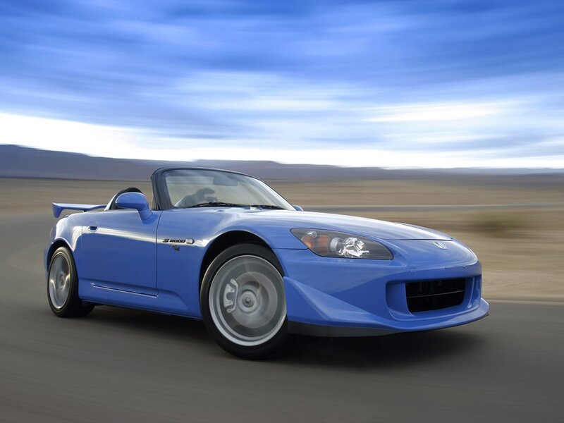 Blue sports car on a road