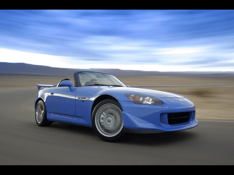 Blue sports car on a road
