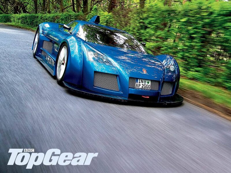Blue sports car on a road