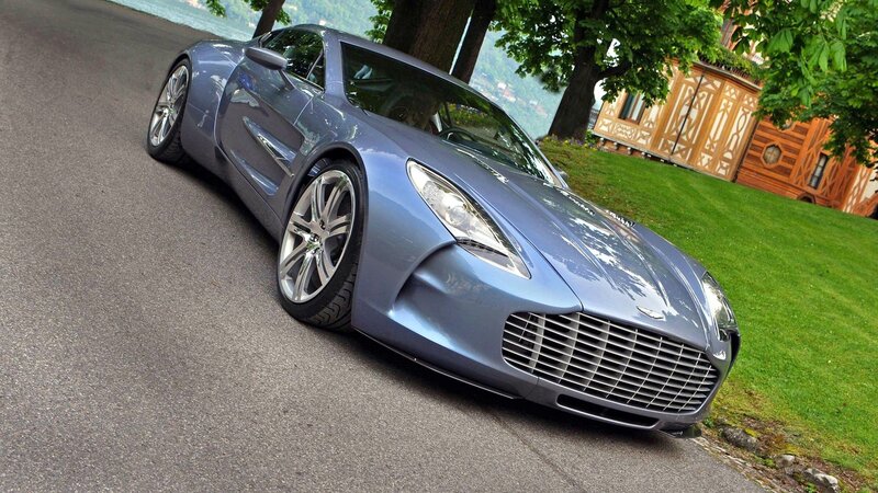 blue sports car on a road