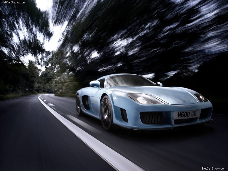 blue sports car on a road