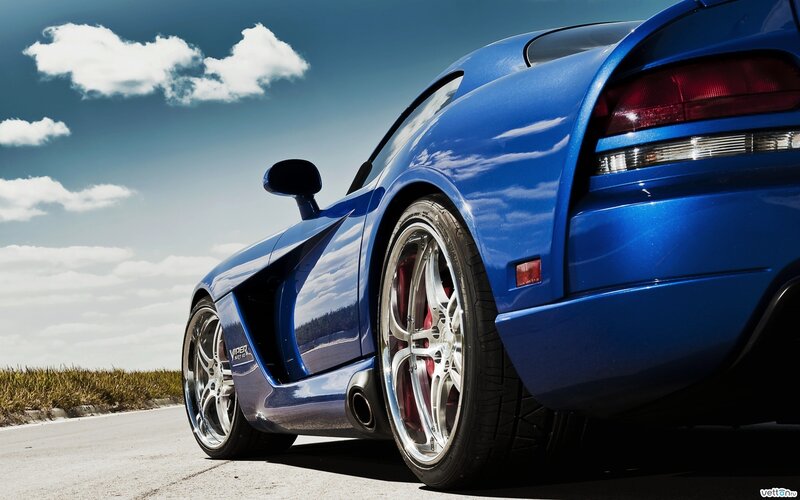 Blue sports car on a road