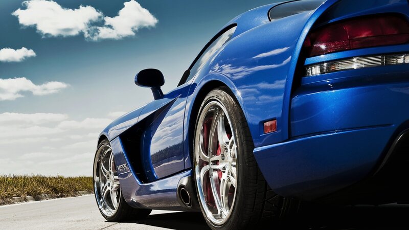 Blue sports car on a road