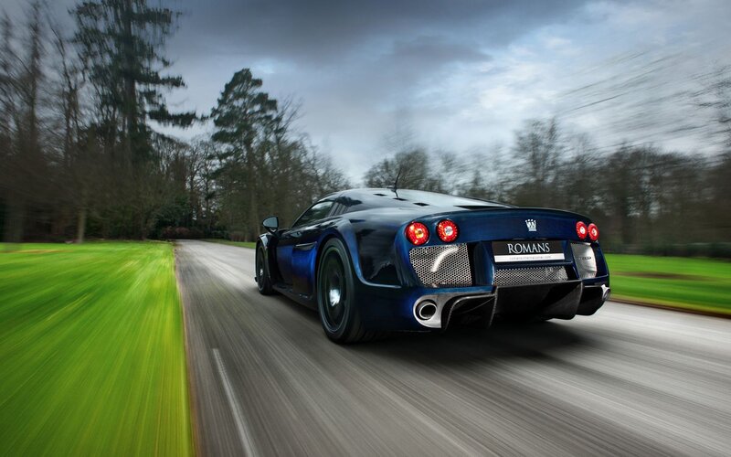 blue sports car on a road