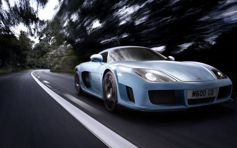 Blue sports car on a winding road