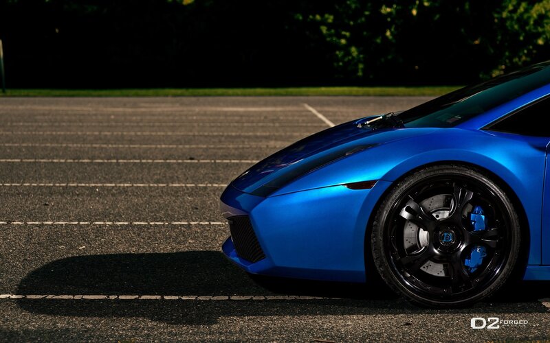 blue sports car on asphalt