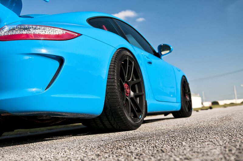 blue sports car on asphalt