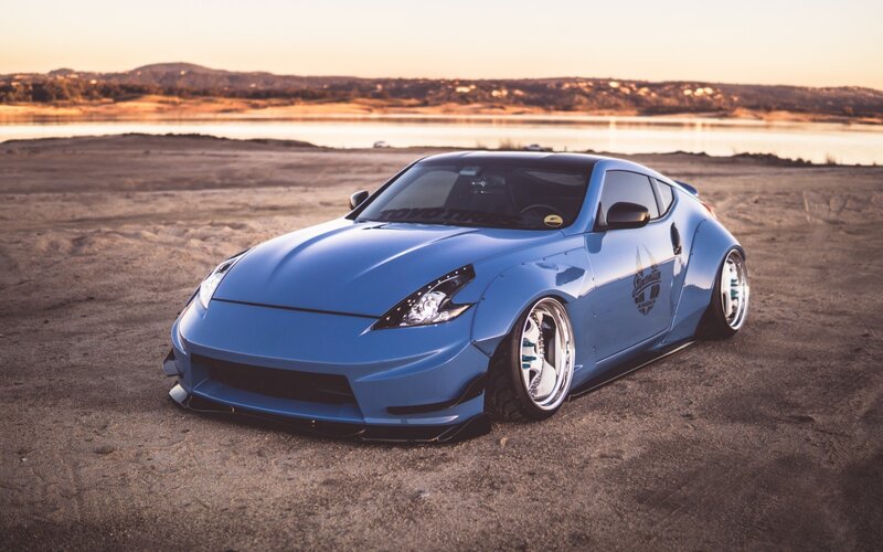blue sports car on beach