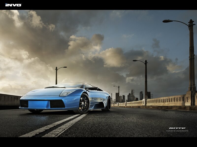 Blue Sports Car on Bridge — Dramatic