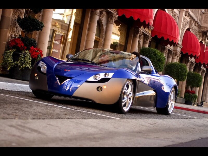 Blue sports car on city street