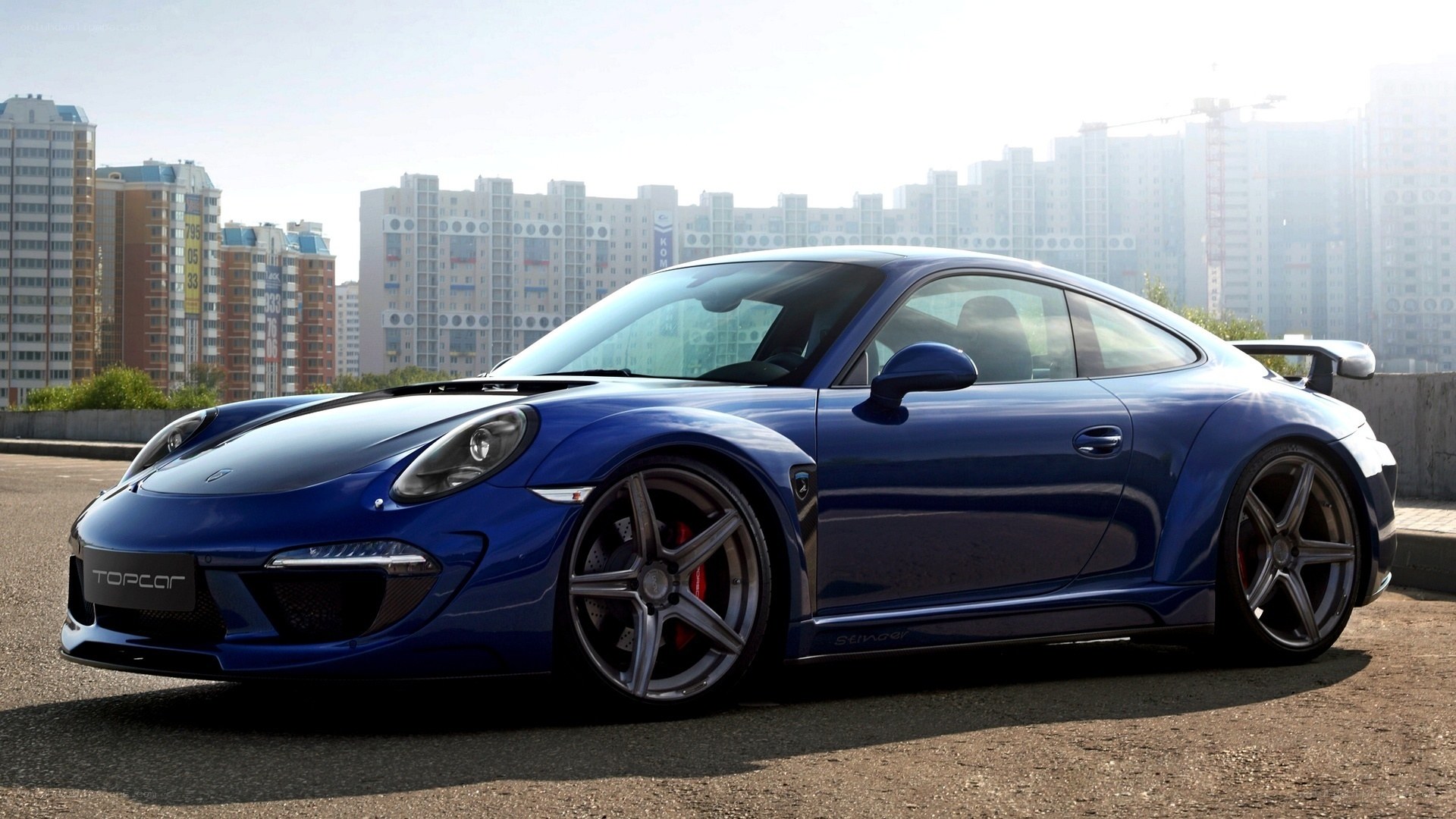 Blue sports car on city street