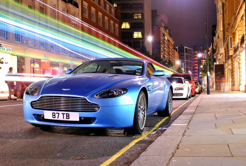 Blue sports car on city street