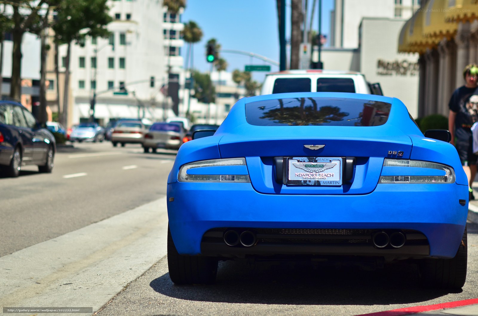 blue sports car on city street