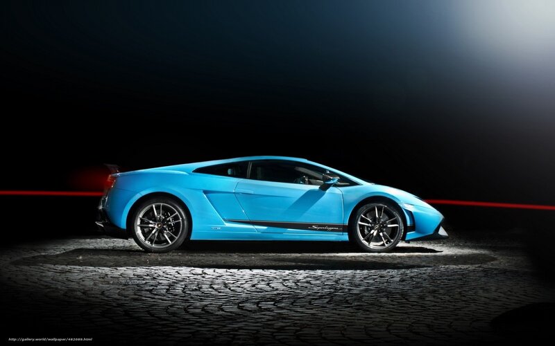 blue sports car on cobblestones