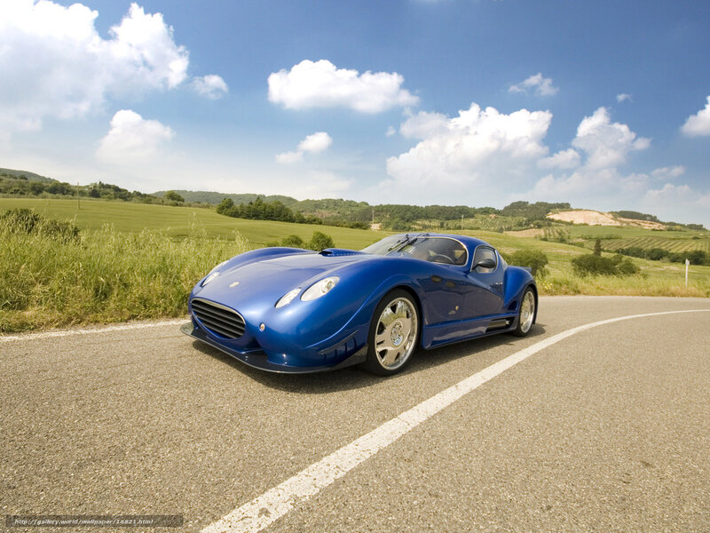 Blue sports car on country road