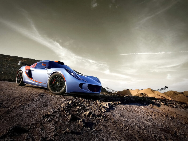 Blue sports car on dirt road