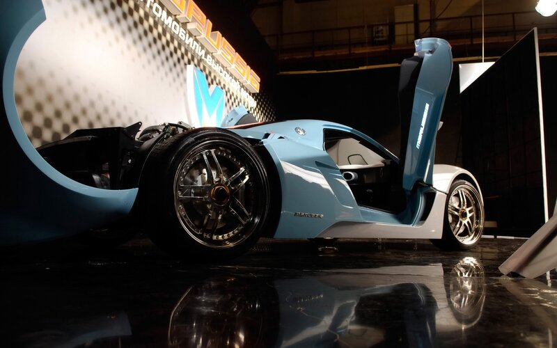 blue sports car on display