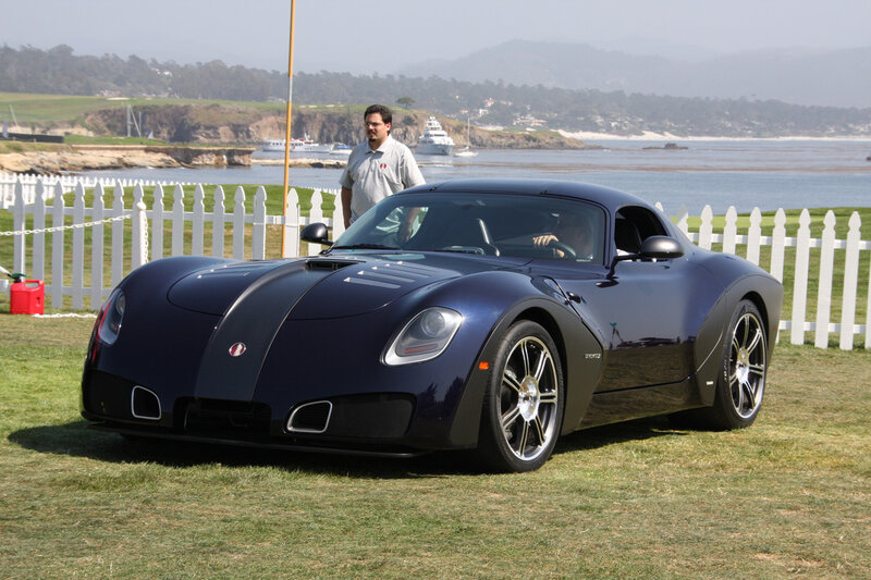Blue sports car on grass