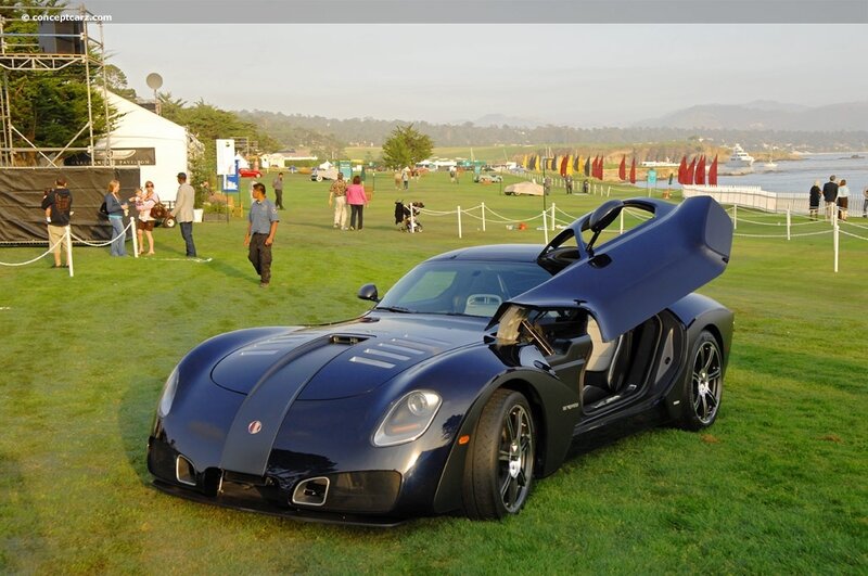 blue sports car on grass
