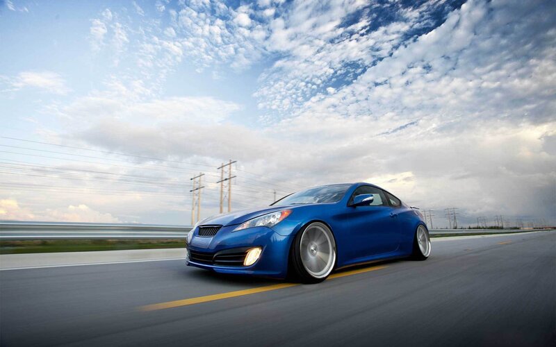 blue sports car on highway