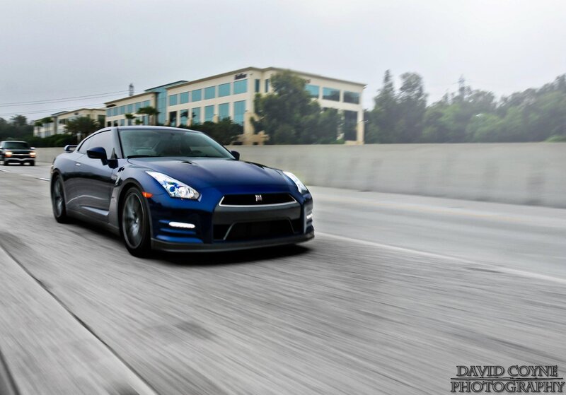 blue sports car on highway