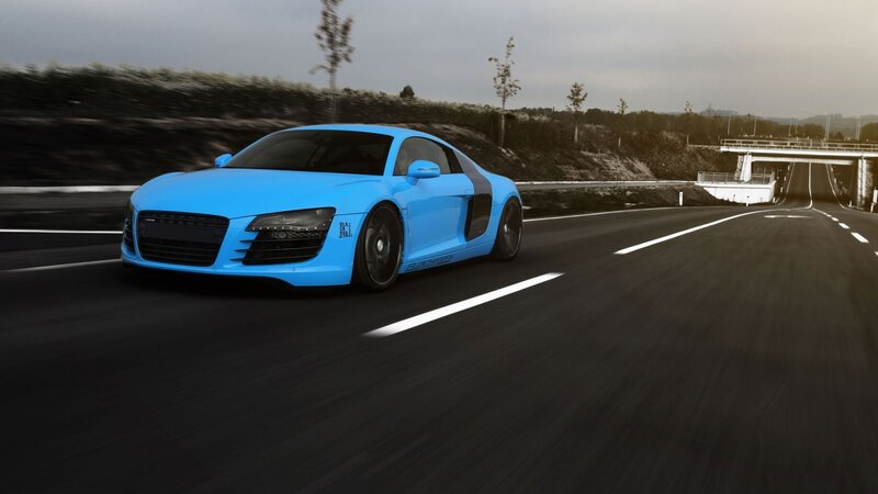 blue sports car on highway