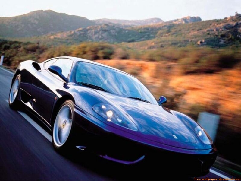 blue sports car on mountain road