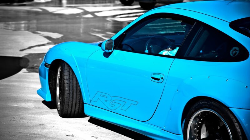 blue sports car on pavement