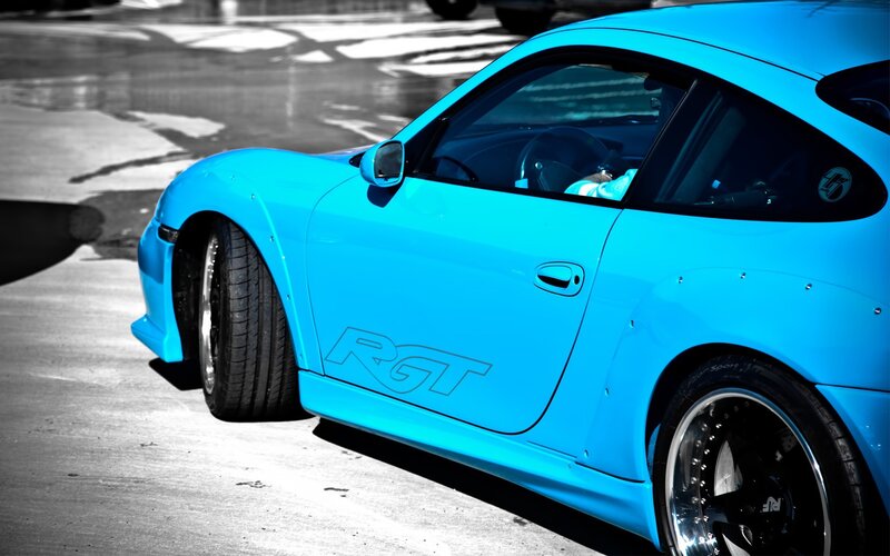 blue sports car on pavement