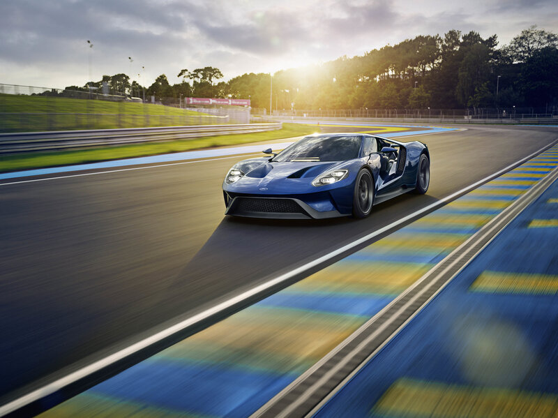 blue sports car on racetrack