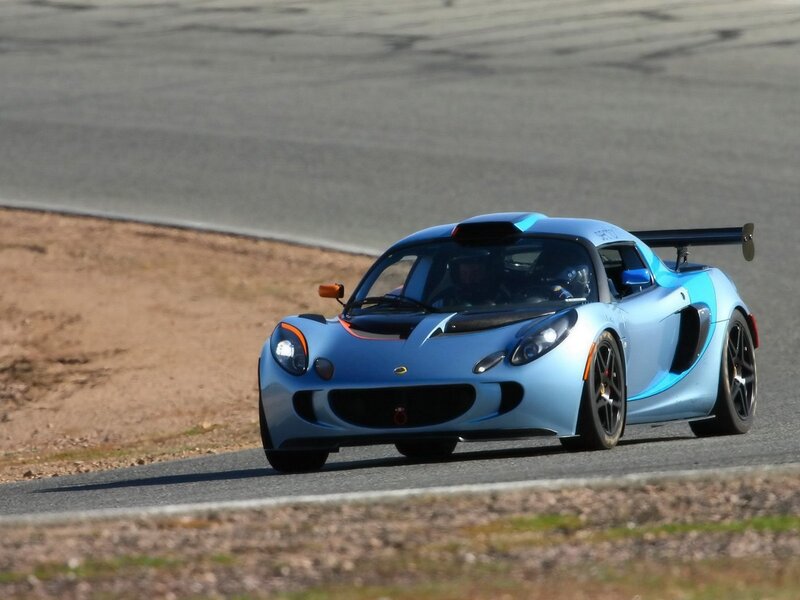 blue sports car on racetrack