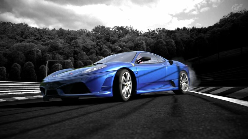 blue sports car on racetrack