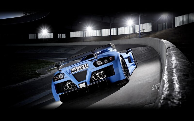 blue sports car on racetrack